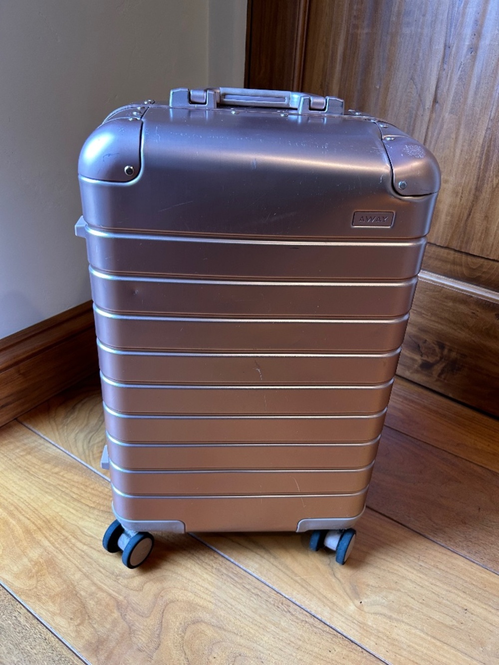 Away Aluminum Bigger Carry-On in Rose Gold